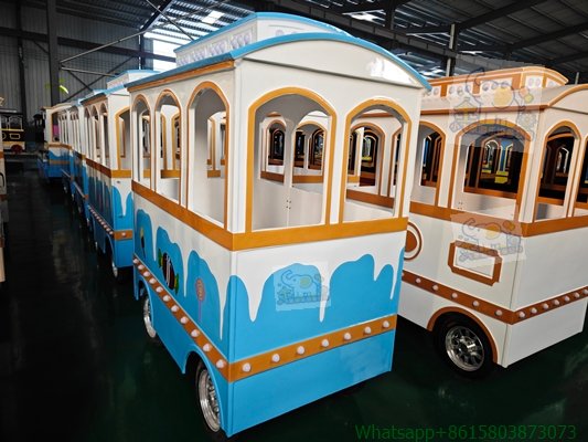 Featuring a classic European retro tram design, multiple carriages share the same color scheme, with rounded cream-patterned trim, warm gold accents, and arched window frames.