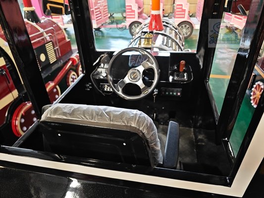Featuring a classic American vintage car design, the front end replicates the silhouette of a retro luxury car, and it's equipped with a large retro steering wheel and a rounded instrument panel; the body has a pure black matte finish, complemented by chrome trim details.